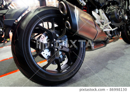 SELANGOR, MALAYSIA - MARCH 4, 2021: Motorcycle tires made from quality rubber. The tires selected must be in accordance with the specifications recommended by the manufacturer. 86998130