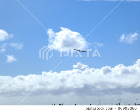 Airplane flying in the blue sky 86998860