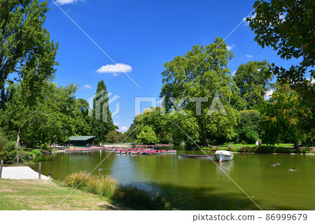 A rental boat floating on Lake Domenil in the forest of Vincennes, Paris, France, taken on August 13, 2021. A rental boat floating on Lake Domenil in the forest of Vincennes, Paris, France, taken on August 13, 2021. 86999679