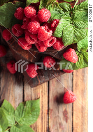 Fresh raspberries with leaves. 87000617