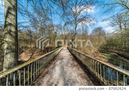 Straight lines of a deserted narrow pedestrian bridge over the valley of the Ossegem city park in Laeken 87002624