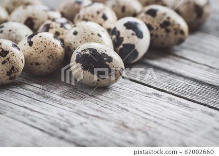 Quail eggs on old wooden table Quail eggs on old wooden table 87002660
