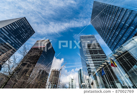 Brussels, Belgium -  The contemporary North Galaxy tower with the Federal government offices and a Belgian and European flag in the business Little Manhattan district 87002769