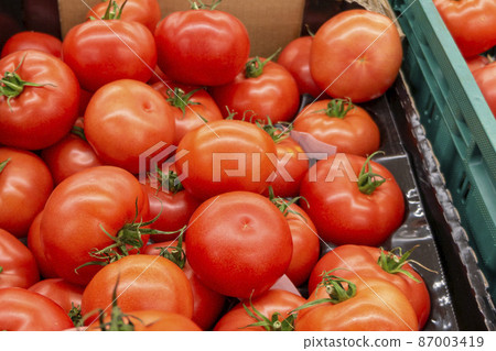 vegetables, fresh tomato  in a supermarket 87003419