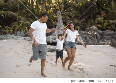 Happy smile european family have rest and run on white sand beach 87003485