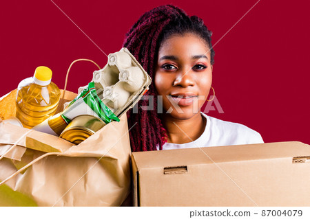 hispanic american volunteer supporting food donation concept 87004079