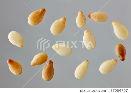 sesame seeds on grey background 87004707
