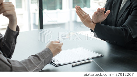 Corruption. The businessman denies the money proposed by his partner to bribe the concept of bribery and corruption Corruption. The businessman denies the money proposed by his partner to bribe the concept of bribery and corruption 87012207