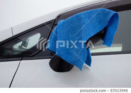 Winter car wash and towel hanging on the mirror Winter car wash and towel hanging on the mirror 87013946