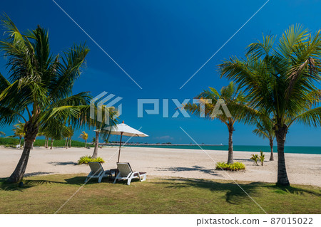 chairs with parasol at summer beach in Cha Am 87015022