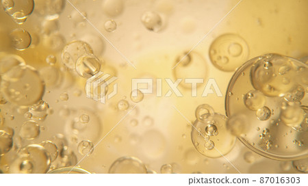 Oil Bubbles on Golden Background 87016303
