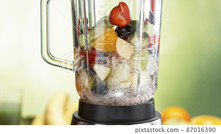 Fresh fruit and vegetables smoothie blended in blender Fresh fruit and vegetables smoothie blended in blender 87016390