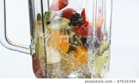 Fresh fruit and vegetables smoothie blended in blender Fresh fruit and vegetables smoothie blended in blender 87016394