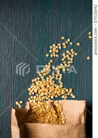 pepper seeds in natural paper bag, top view 87016842