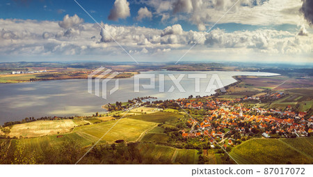 The Nove Mlyny Dam on the Dyje River. Moravian village (Pavlov) with a dock at a large lake The Nove Mlyny Dam on the Dyje River. Moravian village (Pavlov) with a dock at a large lake 87017072