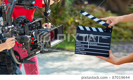 Man hands holding movie clapper. Film director concept. Man hands holding movie clapper. Film director concept. 87019644