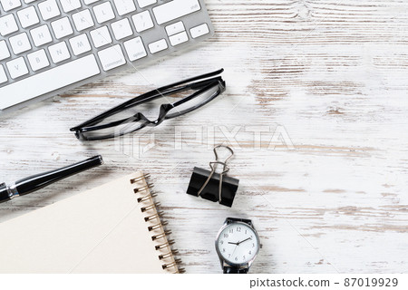 Still life of office workspace with supplies Still life of office workspace with supplies 87019929