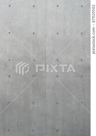 Vertical background image of dark gray concrete wall with separate holes Vertical background image of dark gray concrete wall with separate holes 87020502