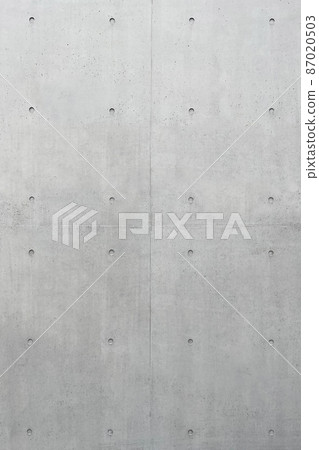 Vertical background image of a gray concrete wall with separate holes 87020503