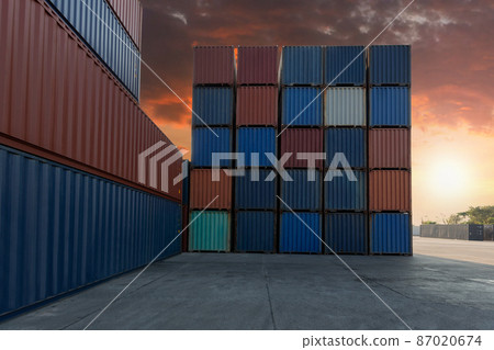 Stack of containers in a harbor. Shipping containers stacked on cargo ship. Stack of containers in a harbor. Shipping containers stacked on cargo ship. 87020674