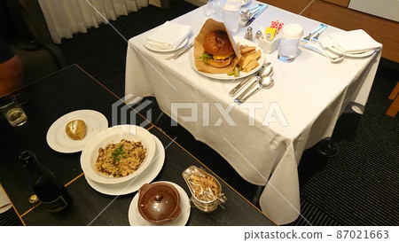 Hotel room service burgers and garlic pilaf 87021663