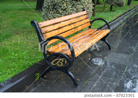 Benches in the Batumi Park on a rainy day 87023301