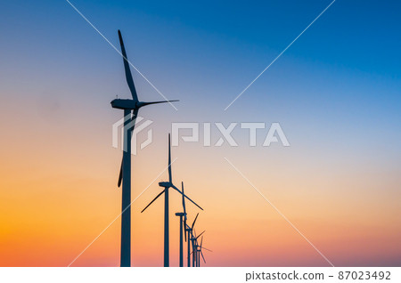 Sunset and wind power generation [Fukuoka Prefecture] 87023492