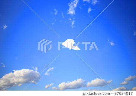 Paper plane flying in the sky Paper plane flying in the sky 87024017