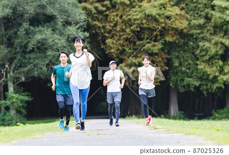Men and women jogging Men and women jogging 87025326