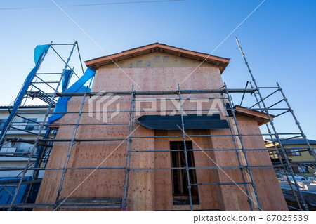 Building up a two-story wooden house 87025539