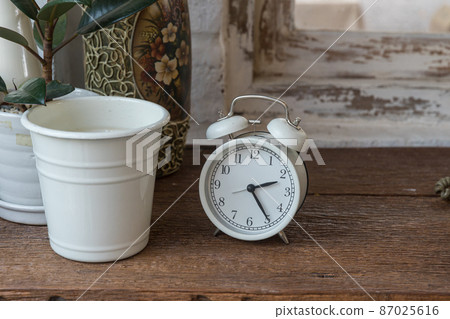 Focus alarm clock vintage style with blurry white background Focus alarm clock vintage style with blurry white background 87025616