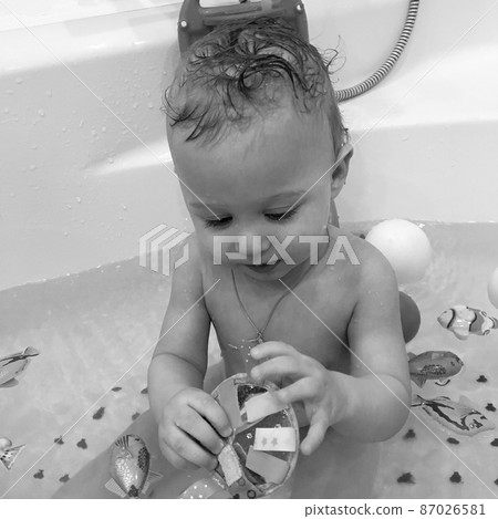 Beautiful baby boy with child face posing photographer 87026581