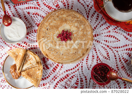 Russian pancake blini with berries and sour cream Russian pancake blini with berries and sour cream 87028022