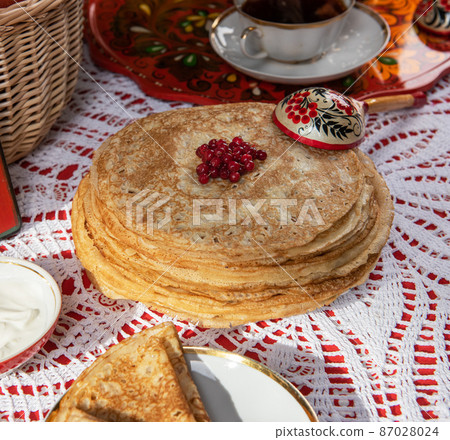 Russian pancake blini with berries and sour cream Russian pancake blini with berries and sour cream 87028024