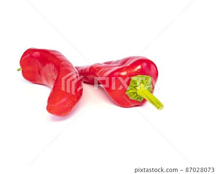 Red pepper on a white background with place for text. 87028073