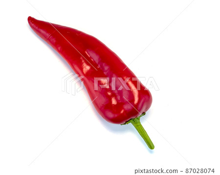 Red pepper on a white background with place for text. 87028074