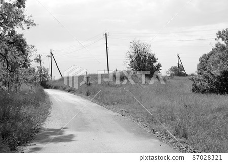 Beautiful empty asphalt road in countryside on colored background Beautiful empty asphalt road in countryside on colored background 87028321