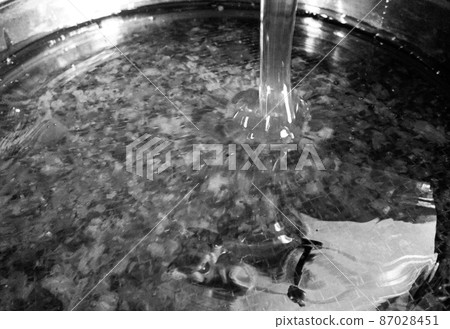 Drop of bee honey drip from hexagonal honeycombs 87028451