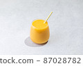 Orange Juice glass on white background 87028782