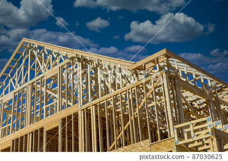 New construction of framed a building with rafters roof beams New construction of framed a building with rafters roof beams 87030625