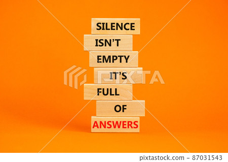 Answers in silence symbol. Wooden blocks with words Silence is not empty it is full of answers. Beautiful orange table, orange background, copy space. Business, answers in silence concept. 87031543