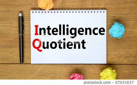 IQ intelligence quotient symbol. Concept words IQ intelligence quotient on white note. Metallic pen. Beautiful wooden background. Business IQ intelligence quotient concept, copy space. 87031637