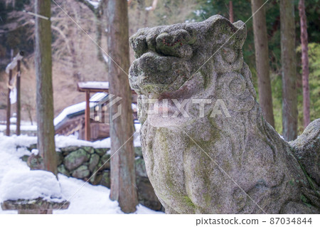 A guardian dog with an open mouth on the east side of Shinkaisansha Shrine A guardian dog with an open mouth on the east side of Shinkaisansha Shrine 87034844