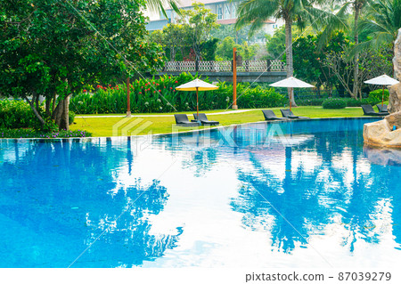 empty beach chair around swimming pool empty beach chair around swimming pool 87039279
