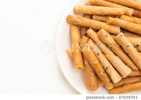 crispy coconut roll on plate crispy coconut roll on plate 87039781