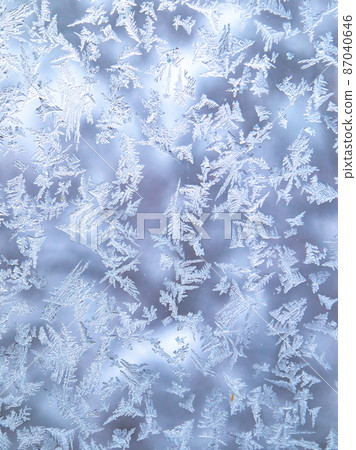 Frost crystals on the window glass Zao Frost crystals on the window glass Zao 87040646