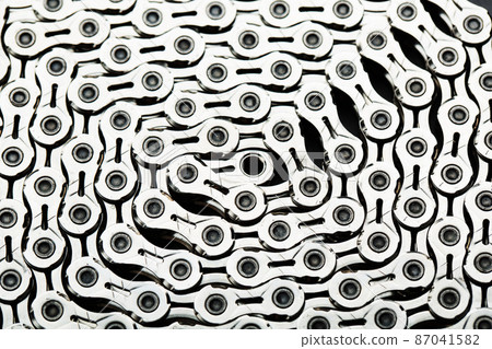 The texture of a bicycle chain is a close-up of the torque transmission links The texture of a bicycle chain is a close-up of the torque transmission links 87041582