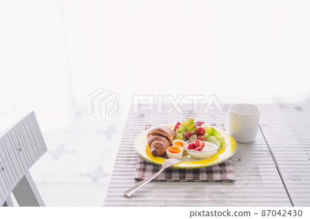 Breakfast croissant and coffee 87042430