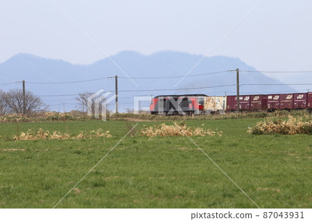 A freight train running on the JR Hakodate Main Line in Oshamambe, Hokkaido A freight train running on the JR Hakodate Main Line in Oshamambe, Hokkaido 87043931