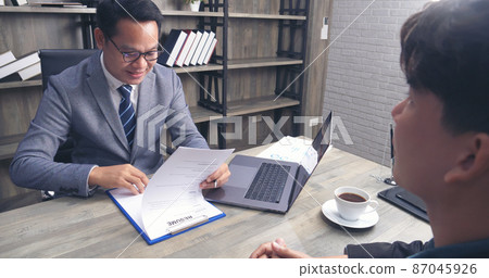 Job HR applicants having an interview with Human resource manager jobs interviewing with confident candidate at business firm office give cv resume. Job Interview with headhunter agent and applicant Job HR applicants having an interview with Human resource manager jobs interviewing with confident candidate at business firm office give cv resume. Job Interview with headhunter agent and applicant 87045926